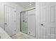 Clean bathroom boasts a walk-in shower and white walls and trim at 2432 Barkers Ridge Dr, Bessemer City, NC 28016