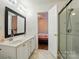 Bathroom features double sinks, a walk-in shower, and neutral paint at 2432 Barkers Ridge Dr, Bessemer City, NC 28016