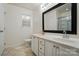 Bathroom with double sinks, a large vanity, and a framed mirror at 2432 Barkers Ridge Dr, Bessemer City, NC 28016