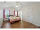 Bright bedroom features wood floors, a ceiling fan, and vaulted ceilings at 2432 Barkers Ridge Dr, Bessemer City, NC 28016