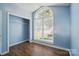 Bedroom with wood floors and an arched window providing plenty of natural light at 2432 Barkers Ridge Dr, Bessemer City, NC 28016