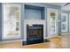 Living room fireplace is framed by windows that provide great natural light at 2432 Barkers Ridge Dr, Bessemer City, NC 28016