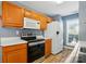 Updated kitchen with wooden cabinetry and modern appliances at 2432 Barkers Ridge Dr, Bessemer City, NC 28016