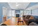 Inviting living room features a fireplace, abundant natural light, and stylish decor at 2432 Barkers Ridge Dr, Bessemer City, NC 28016