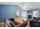 Bright living room with vaulted ceilings, wood floors, a fireplace, and comfortable seating at 2432 Barkers Ridge Dr, Bessemer City, NC 28016