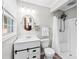 Bathroom featuring modern vanity, round mirror, and walk-in shower at 245 Kingsway Cir, Charlotte, NC 28214