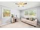 Bright bedroom with large windows, daybed, and vanity with natural light at 245 Kingsway Cir, Charlotte, NC 28214