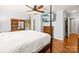 Spacious bedroom featuring a four-poster bed, hardwood floors, and a TV at 245 Kingsway Cir, Charlotte, NC 28214