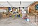Spacious garage with exposed brick, storage racks, and access to the home's interior at 245 Kingsway Cir, Charlotte, NC 28214