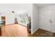 Bright living room with hardwood floors, large windows, and white walls at 245 Kingsway Cir, Charlotte, NC 28214