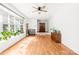 Spacious living room with hardwood floors, a large bay window, and classic interior design at 245 Kingsway Cir, Charlotte, NC 28214