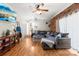 Cozy living room with a large sectional sofa, brick accent wall, and natural light at 245 Kingsway Cir, Charlotte, NC 28214