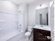 Bright bathroom featuring a bathtub, toilet, vanity with sink, and a mirror; a clean, functional space at 2535 Ruby Dixon Crossing Dr # 19, Gastonia, NC 28056