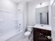Bathroom with a tub/shower combo, single vanity, and ceramic tile flooring at 2535 Ruby Dixon Crossing Dr # 19, Gastonia, NC 28056