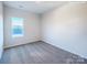 Neutral carpeted bedroom with a window providing natural light at 2535 Ruby Dixon Crossing Dr # 19, Gastonia, NC 28056