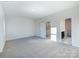 Bedroom with neutral carpet, painted walls, and natural light streaming in from the open doorway at 2535 Ruby Dixon Crossing Dr # 19, Gastonia, NC 28056