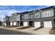Modern townhome row showcases stylish exteriors, with stone accents and eye-catching color schemes and attached garages at 2535 Ruby Dixon Crossing Dr # 19, Gastonia, NC 28056