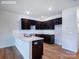 Modern kitchen features dark cabinetry, a white countertop island, and stainless steel appliances at 2535 Ruby Dixon Crossing Dr # 19, Gastonia, NC 28056