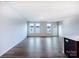 A well-lit living room showcasing wood floors and multiple windows that provide lots of natural light at 2535 Ruby Dixon Crossing Dr # 19, Gastonia, NC 28056