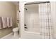 Bathroom featuring a tub with shower, toilet, and neutral wall art at 2730 Tiffany Dr, Rock Hill, SC 29732