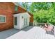 A nice view of a wooden deck with chairs and table outside of a brick home and sunroom at 2730 Tiffany Dr, Rock Hill, SC 29732