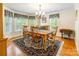 Traditional dining room featuring natural light, hardwood flooring, and a decorative rug at 2730 Tiffany Dr, Rock Hill, SC 29732