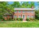 Classic two-story brick home with gray shutters, landscaping, and inviting front entrance at 2730 Tiffany Dr, Rock Hill, SC 29732