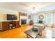 Bright living room with a fireplace, hardwood floors, neutral decor, and abundant natural light at 2730 Tiffany Dr, Rock Hill, SC 29732