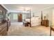 Bright main bedroom featuring hardwood furnishings, soft carpet, and a ceiling fan at 2730 Tiffany Dr, Rock Hill, SC 29732