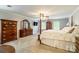Spacious main bedroom with four-poster bed, crown molding, and neutral carpet at 2730 Tiffany Dr, Rock Hill, SC 29732