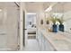 Bright bathroom with double sinks, quartz countertops, and a glass-enclosed shower at 3009 Loso Ter # 58, Charlotte, NC 28217