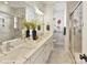 Elegant bathroom with marble floors, double sinks, and a modern glass shower at 3009 Loso Ter # 58, Charlotte, NC 28217