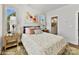 Tranquil bedroom with neutral decor, hardwood floors, and a view to the bathroom at 3009 Loso Ter # 58, Charlotte, NC 28217