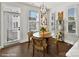 Cozy dining area with wood floors, chandelier lighting, and lots of natural light at 3009 Loso Ter # 58, Charlotte, NC 28217