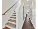 Hallway with beautiful hardwood floors leading to an adjacent room at 3009 Loso Ter # 58, Charlotte, NC 28217