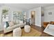 Cozy living room featuring an art piece, couch, and a drink cart leading to a powder room for convenience at 3009 Loso Ter # 58, Charlotte, NC 28217