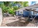 Backyard with a deck, a swing, a fire pit, and lawn furniture at 310 Patterson Ave, Mooresville, NC 28115