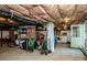 A functional basement with a door to the outside, with unfinished ceilings and concrete floor at 310 Patterson Ave, Mooresville, NC 28115
