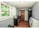 Exercise room with wood floors, a window, and exercise equipment at 310 Patterson Ave, Mooresville, NC 28115