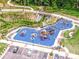 Aerial view of a community playground featuring diverse play structures and safety surfacing at 310 Patterson Ave, Mooresville, NC 28115