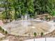 Community splash pad with water features, seating areas, and nearby landscaping at 310 Patterson Ave, Mooresville, NC 28115