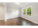 Bright bedroom features large windows, crown molding, and hardwood floors at 3101 Willowbrae Rd, Charlotte, NC 28226
