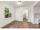 Charming dining room boasts wood-look floors and built-in cabinets offering plenty of storage at 3101 Willowbrae Rd, Charlotte, NC 28226