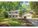 Charming two-story home with mature trees, attached garage, and a well-manicured lawn at 3101 Willowbrae Rd, Charlotte, NC 28226