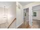 Hallway featuring hardwood floors leading to the home's bedrooms at 3101 Willowbrae Rd, Charlotte, NC 28226