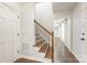 Inviting foyer features wood-look floors, white trim, and a staircase with wrought iron accents at 3101 Willowbrae Rd, Charlotte, NC 28226