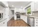 Bright and updated kitchen with stainless steel appliances and stone backsplash at 3101 Willowbrae Rd, Charlotte, NC 28226