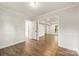 Open living room featuring hard surface floors, crown molding, and neutral paint colors at 3101 Willowbrae Rd, Charlotte, NC 28226