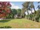 Expansive grassy yard with mature trees at 3101 Willowbrae Rd, Charlotte, NC 28226
