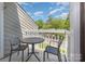 Cozy balcony with seating, perfect for enjoying morning coffee and neighborhood views at 3201 Heathstead Pl # C, Charlotte, NC 28210